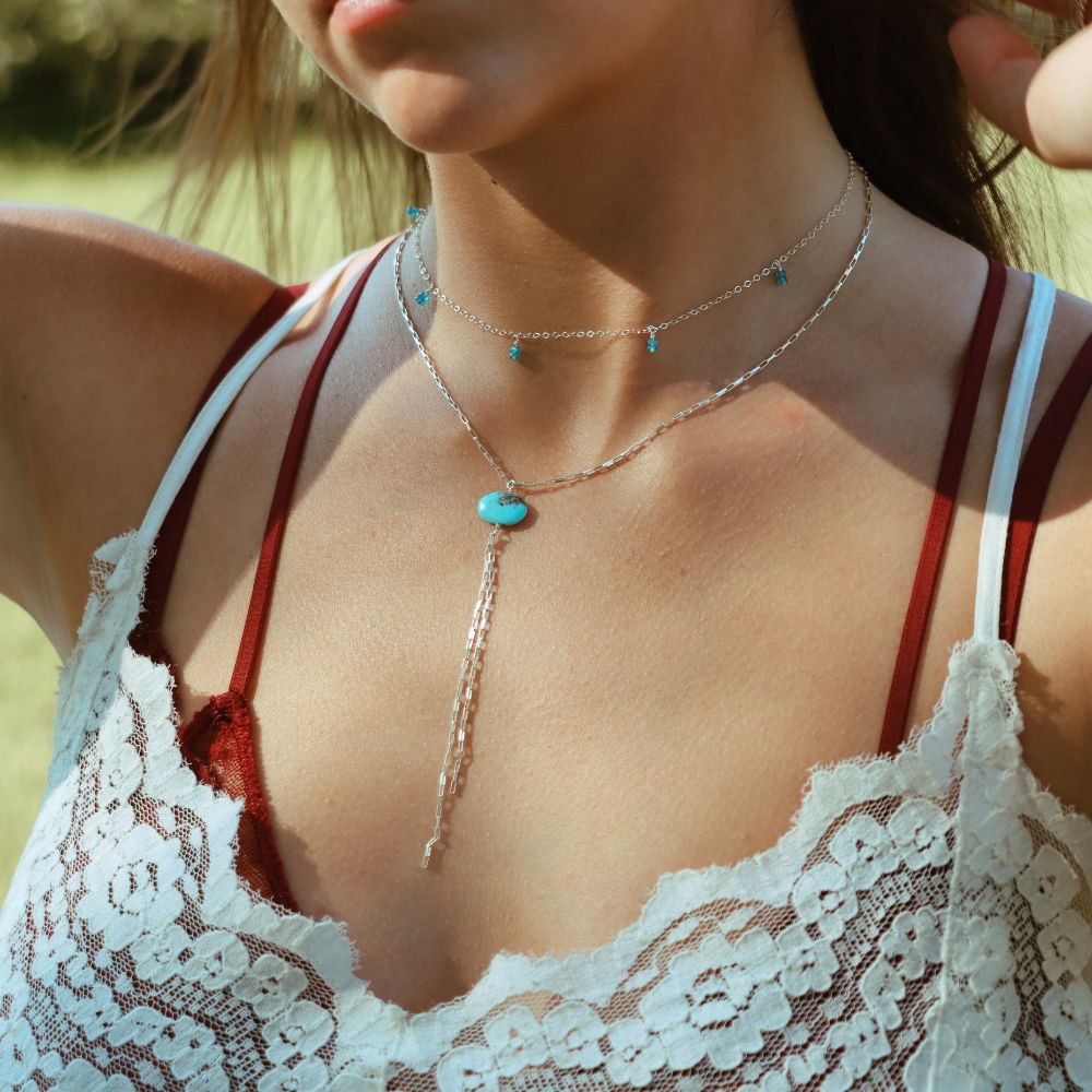 model wearing sterling silver jewelry with gemstones