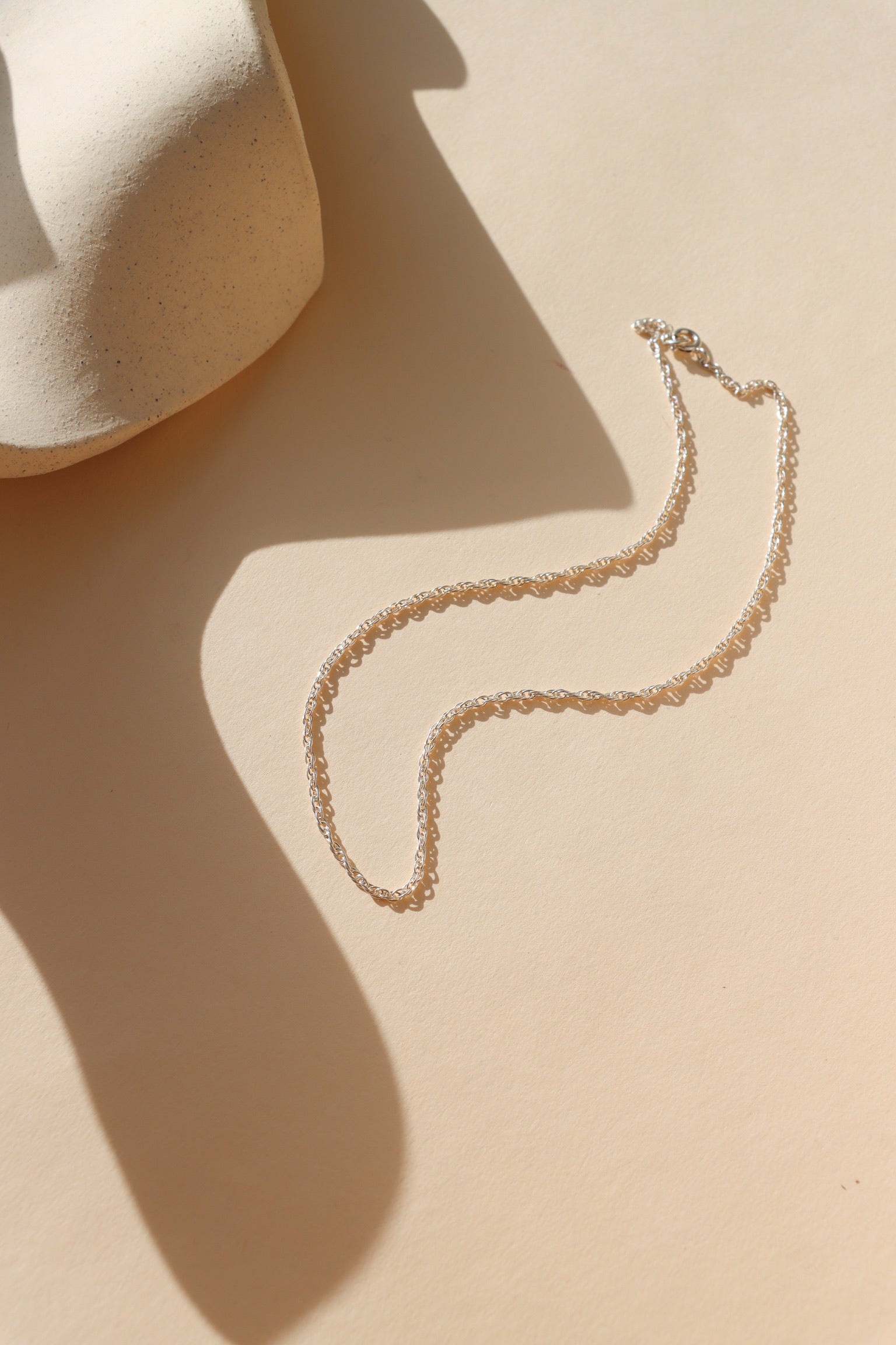 sterling silver chain necklace in the sunlight
