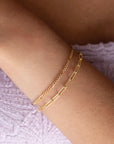 Capri Bracelet worn by a model and the piper bracelet both in 14k gold fill 