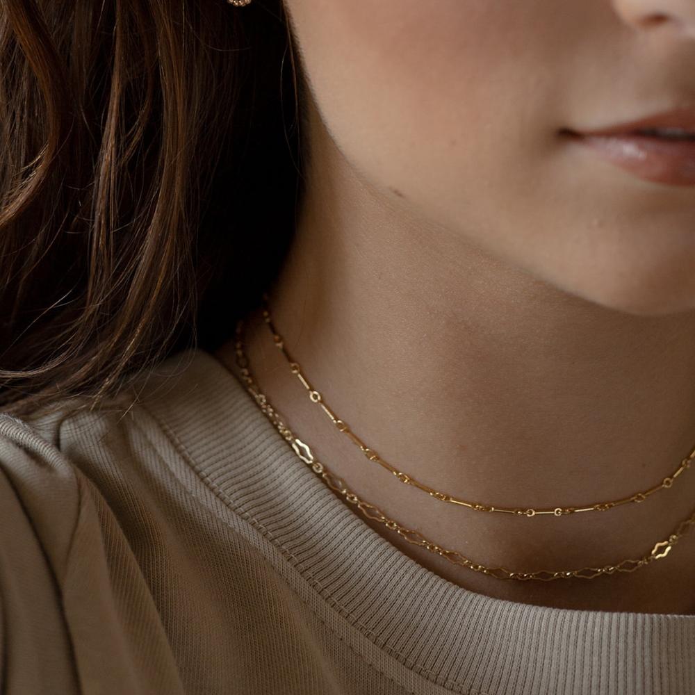 Model wearing 14k gold fill Clara chain paired with the dot and dash chain