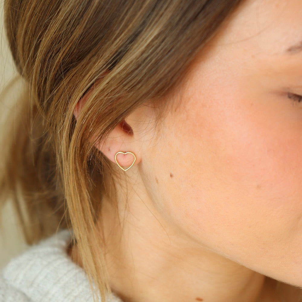 gold fill open heart wire stud earrings on a blonde model