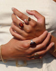 The Scarlett Ring, available in 14k gold fill or sterling silver, features a stunning Red Tiger Eye gemstone on a triple 14k gold fill band