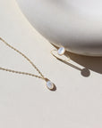 Mother of pearl ring called the Aurelia ring and Aurelia necklace