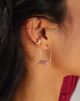 model wearing pink opal arches in sterling silver pair with sterling silver ear cuff