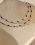 14k gold fill chain with sapphire gemstones paired with sterling silver chain with sapphire gemstones