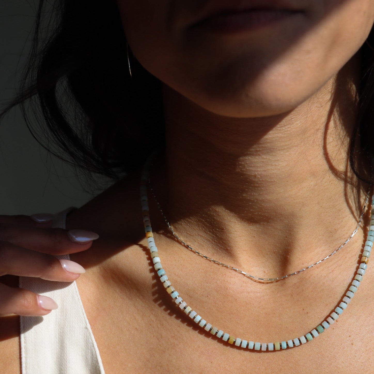 model wearing sterling silver chain necklace with amazonite beaded necklace