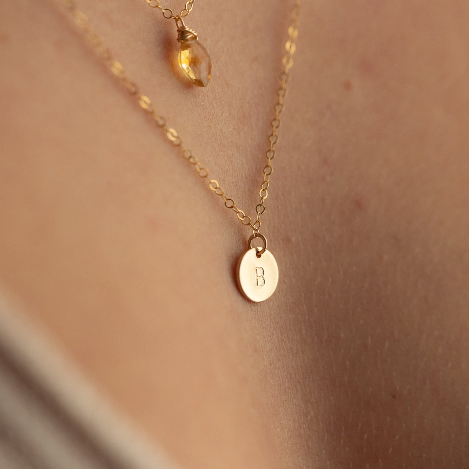 model wearing 14k gold fill dainty chain necklace with hand stamped circle charm
