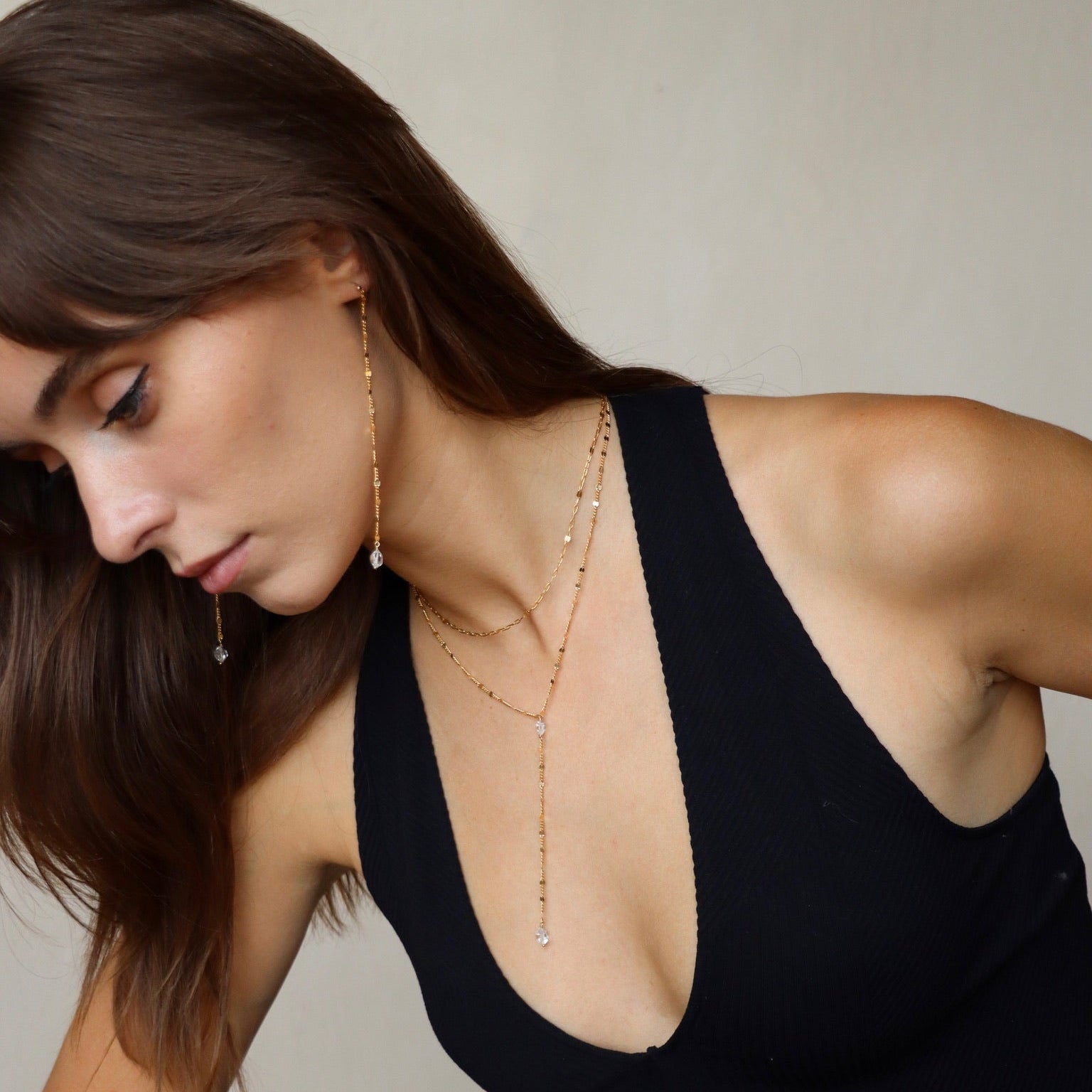 Gold-filled lariat necklace with Herkimer Diamonds and Sunburst chain links. Handmade and radiant for effortless everyday layering.