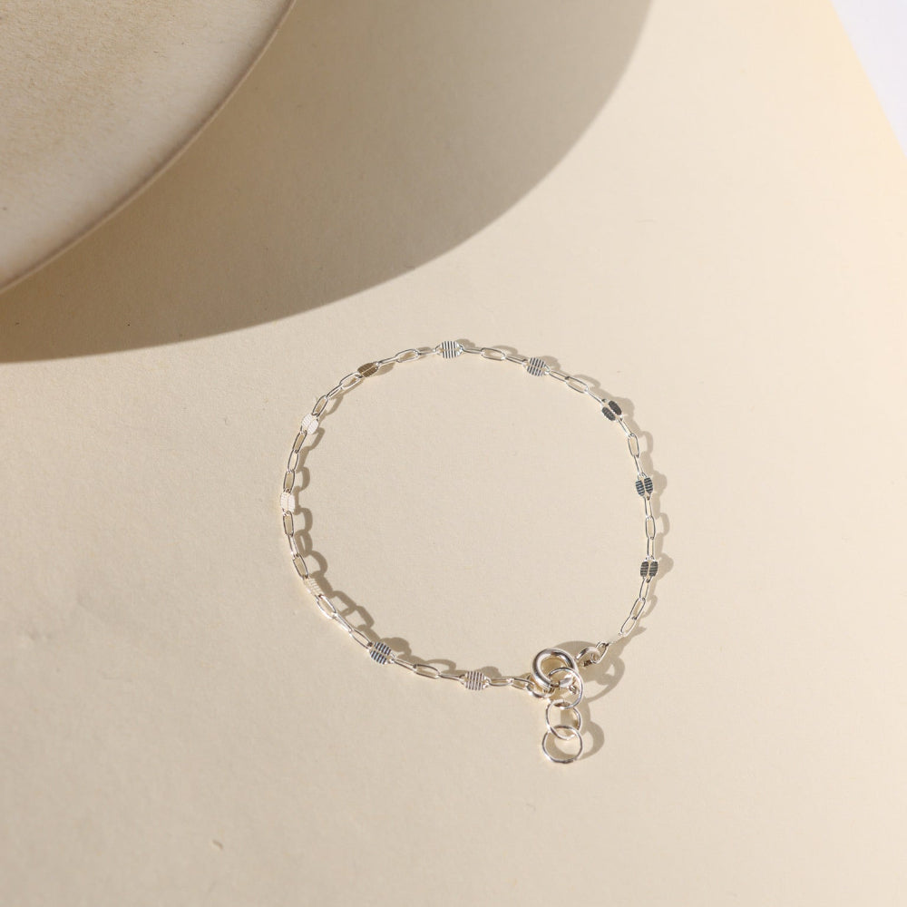 Sunspell Bracelet with softly textured links, available in 14k gold fill or sterling silver. Lightweight and comfortable, perfect for effortless layering and adding a subtle glow to any stack.