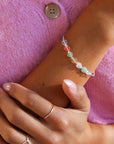 model wearing multicolored heart bead bracelet with sterling silver chain