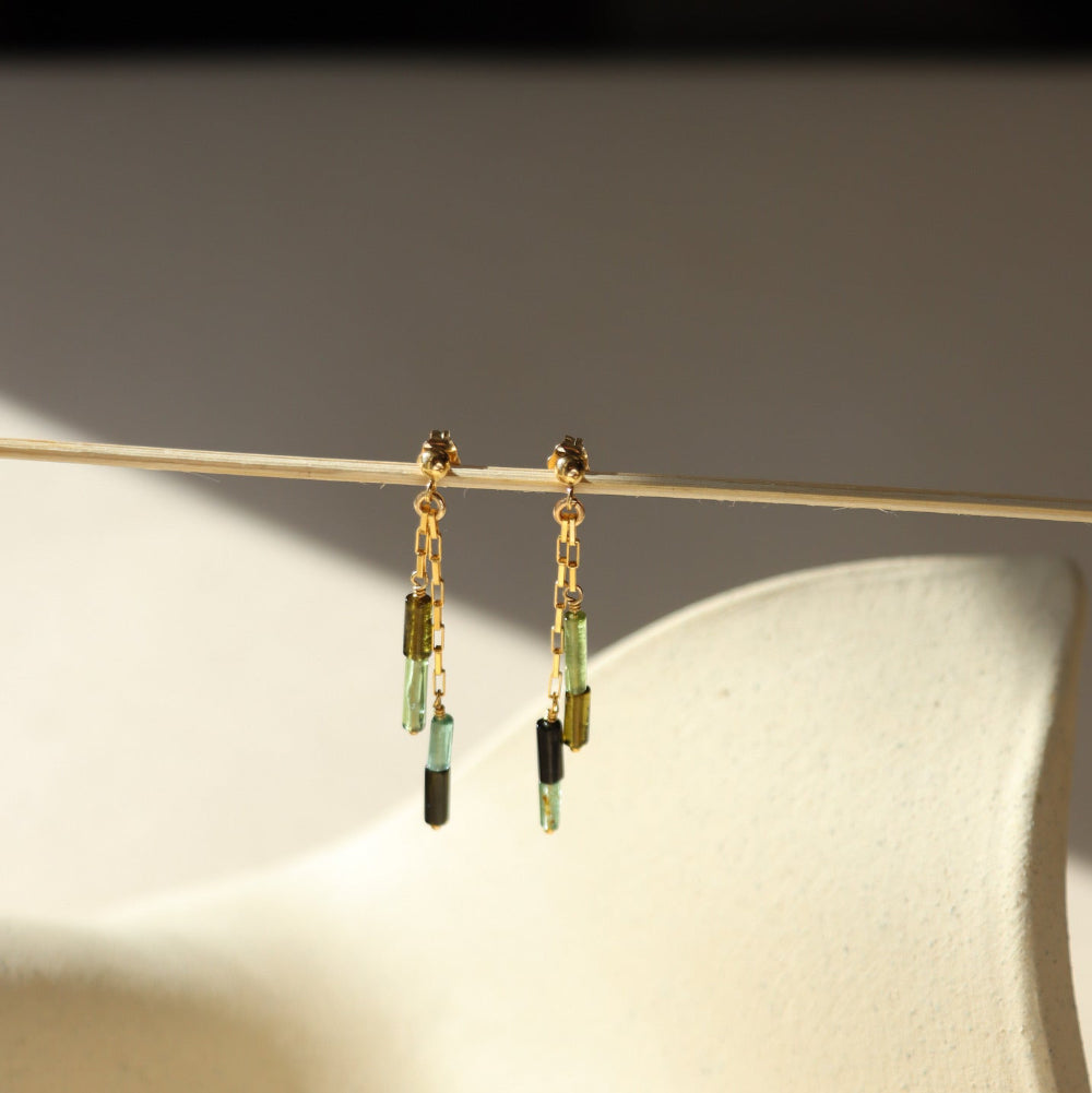 14k gold fill stud earrings with chain and tourmaline beads in the sunlight