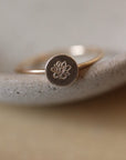 Birth flower ring featuring a Lotus flower for the month of August. Mother's Day Gifts, Personalized Jewelry, Handmade Jewelry, Gold Ring that's flower stamped by Token Jewelry in Eau Claire, WI