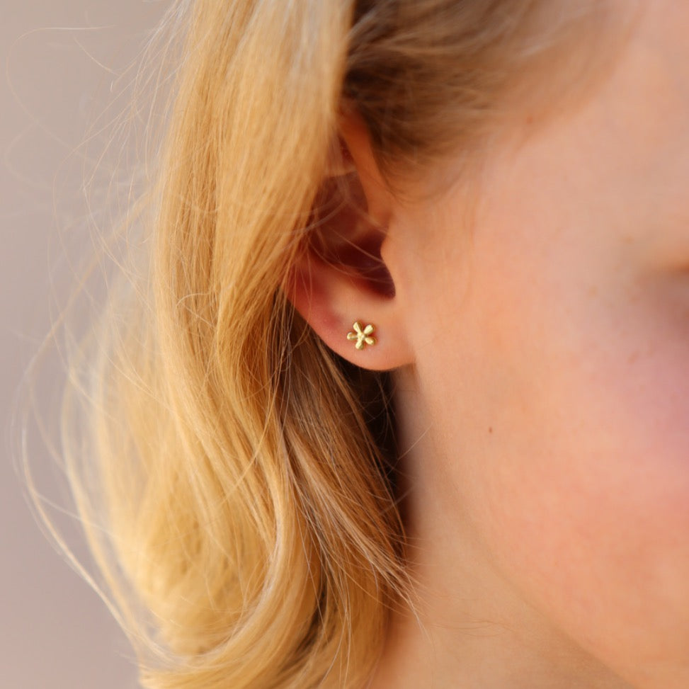 Model wearing 14k gold fill Daisy Studs