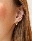 Model wearing Mia Huggies in 14k gold fill.