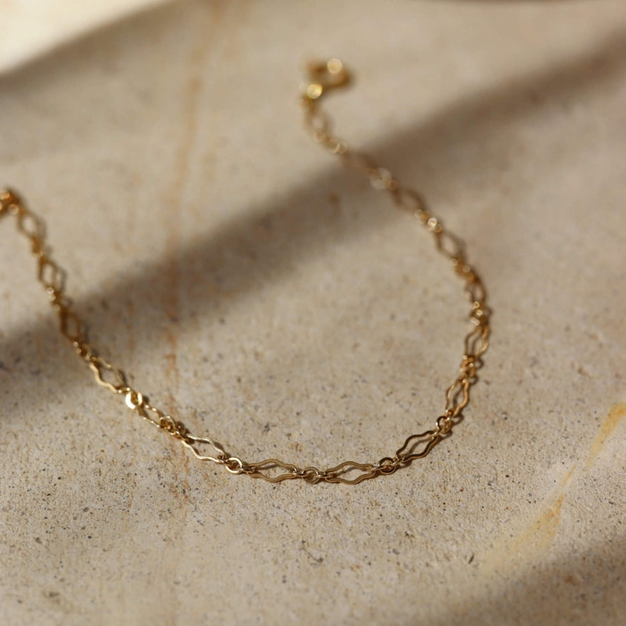 Feminine curvy chain linked bracelet in 14k gold fill. Spring hook clasp closure and half inch extender to make the bracelet adjustable. Handmade by Token Jewelry in Eau Claire, WI