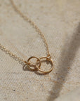 14k solid gold. An heirloom you'll pass along in your family through generations, token jewelry heirloom collection, solid gold, timeless, everyday jewelry, solid gold unity necklace, classic, handmade, made in eau claire, wisconsin, USA, woman owned business, small business