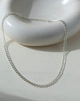 925 Sterling Silver Double link necklace laid on top of a white clay plate. Jewelry is handmade in Eau Claire Wisconsin. Hypoallergenic jewelry made to live in.